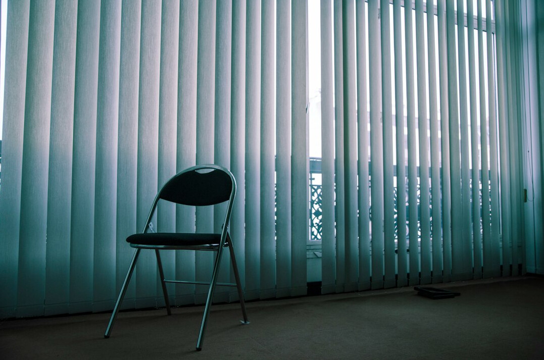 Bright empty office room with large windows