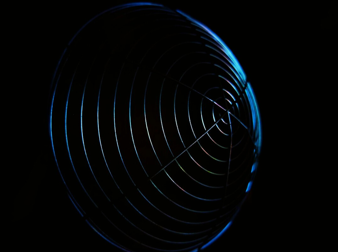 Studio microphone in front of a dark background