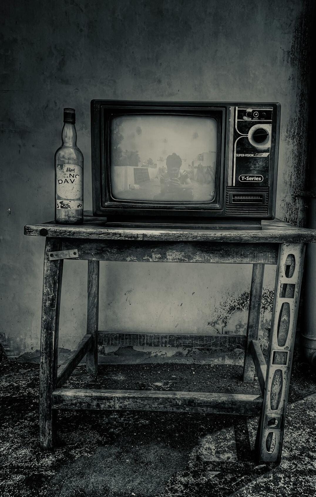 Old cathode ray tube television in a dim room